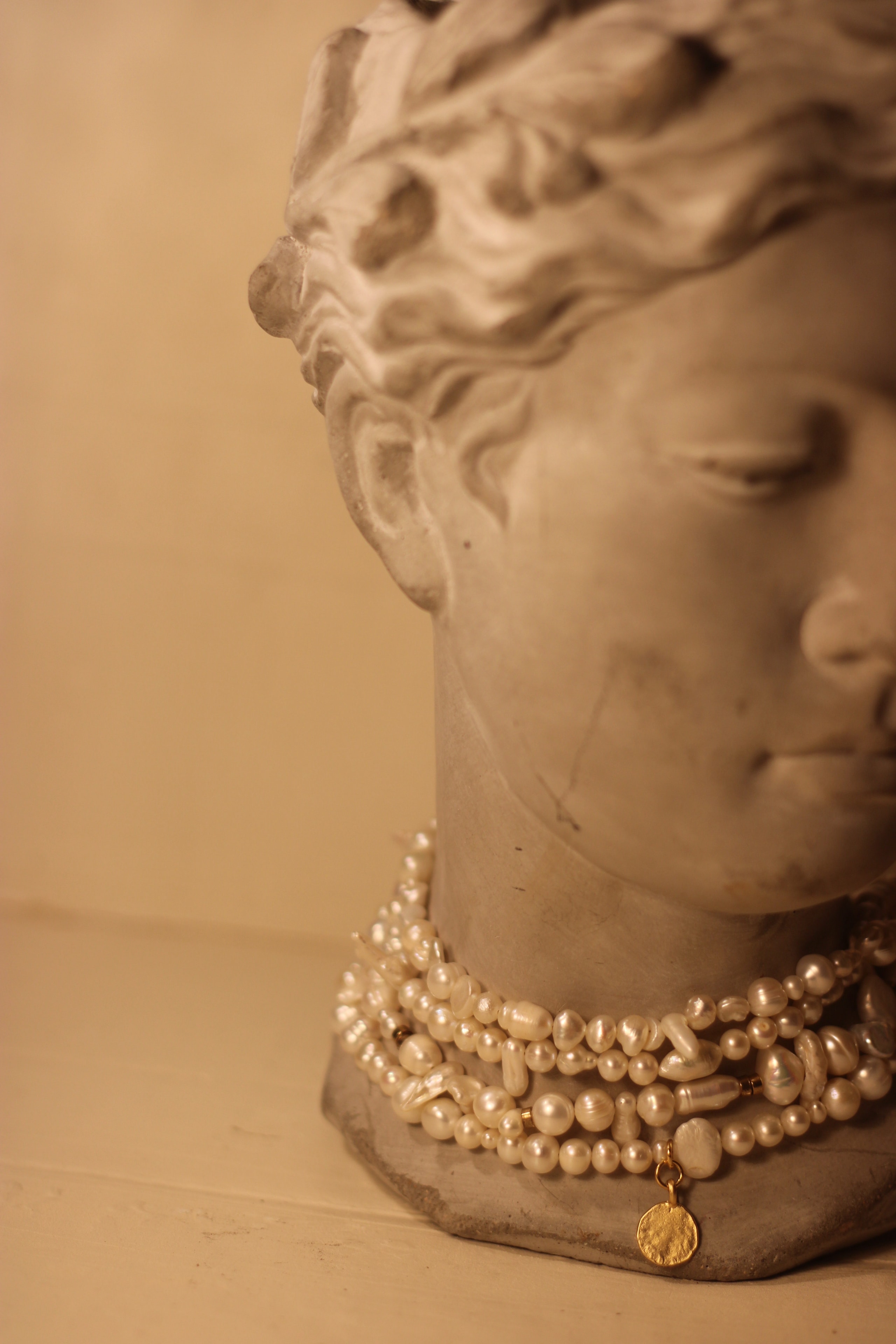 Classical bust with pearl necklace