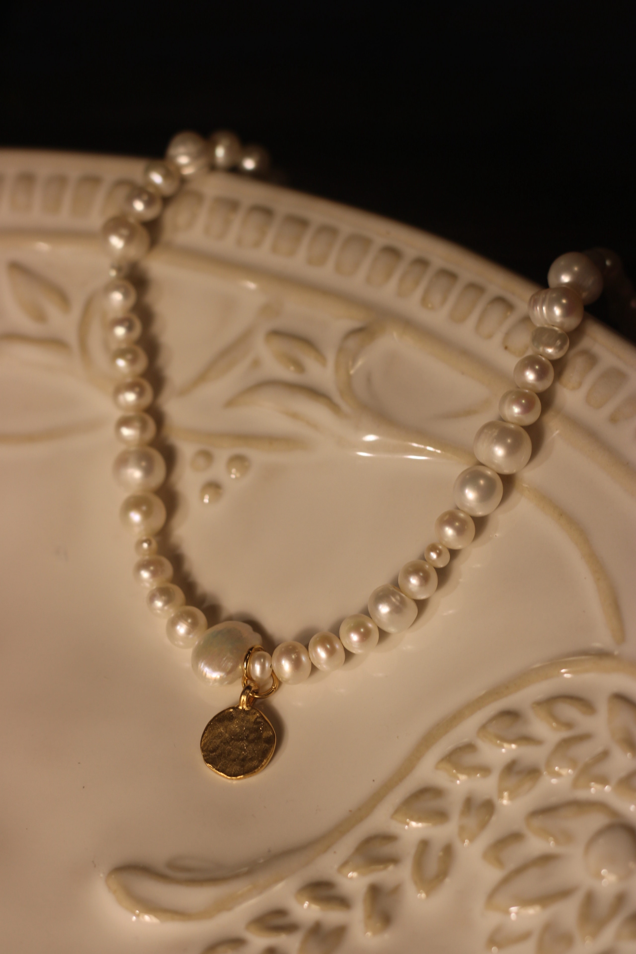 Pearl bracelet with gold coin charm